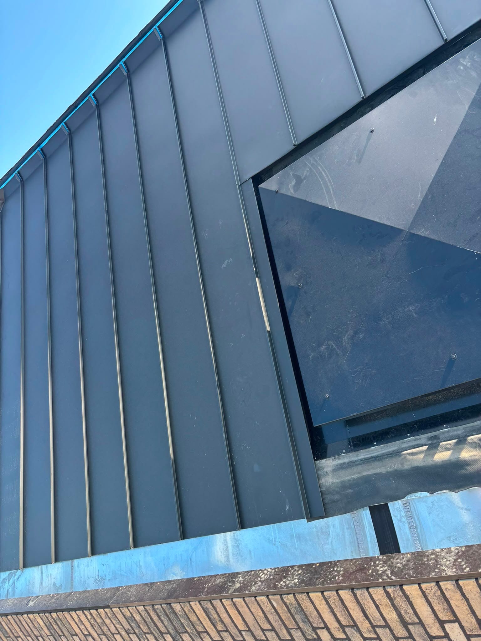 Zinken gevelbekleding in roevenwerk